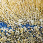 An abstract nature painting titled The Valley of Flowers featuring a textured field of golden, beige, and white grass brushstrokes with a striking horizontal cluster of vibrant blue wild flowers.